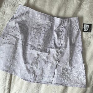 Selling new mini skirt from garage size M